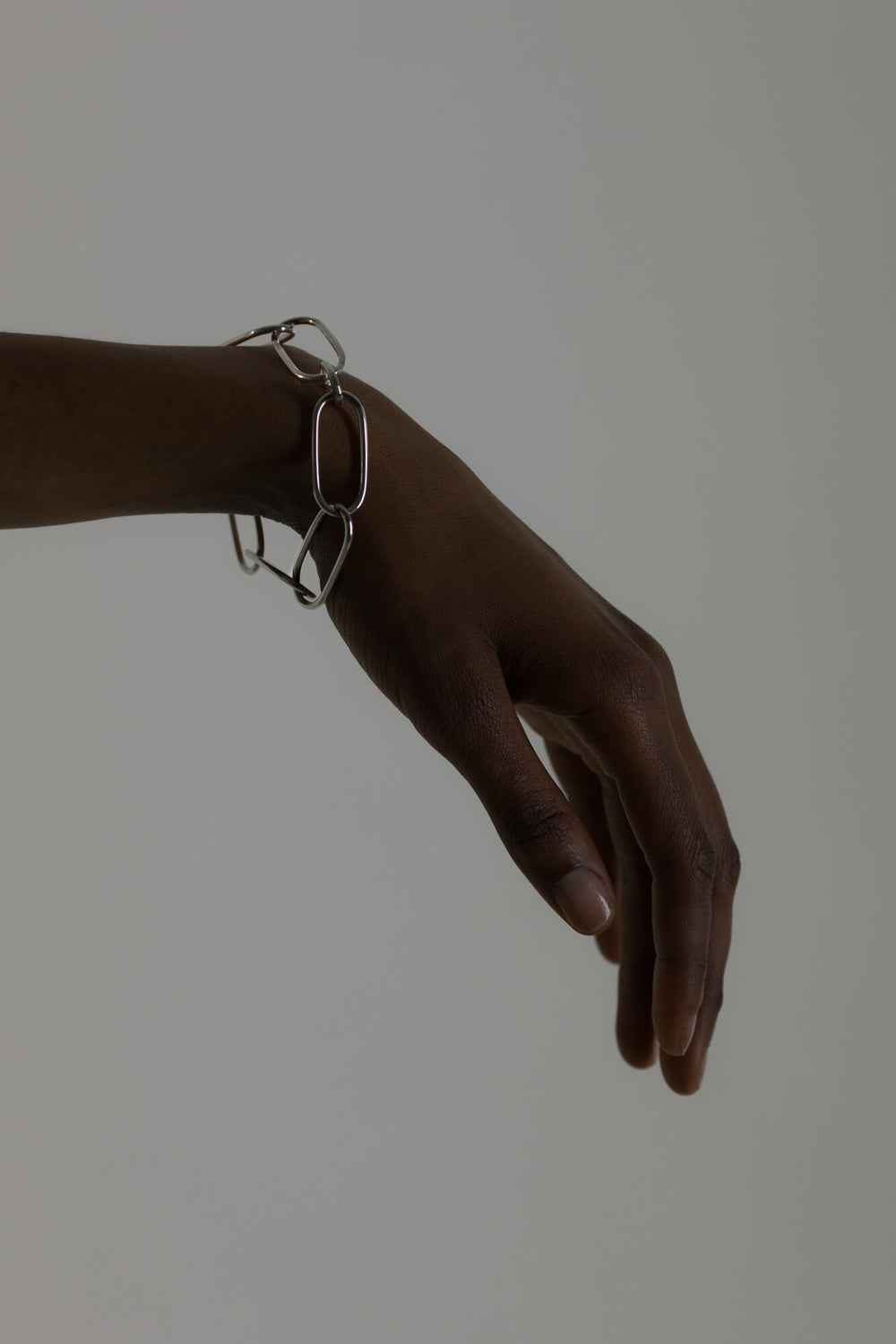 Statement bracelet made from bold link chains with a high gloss finish. Silver jewelry handmade in Berlin.